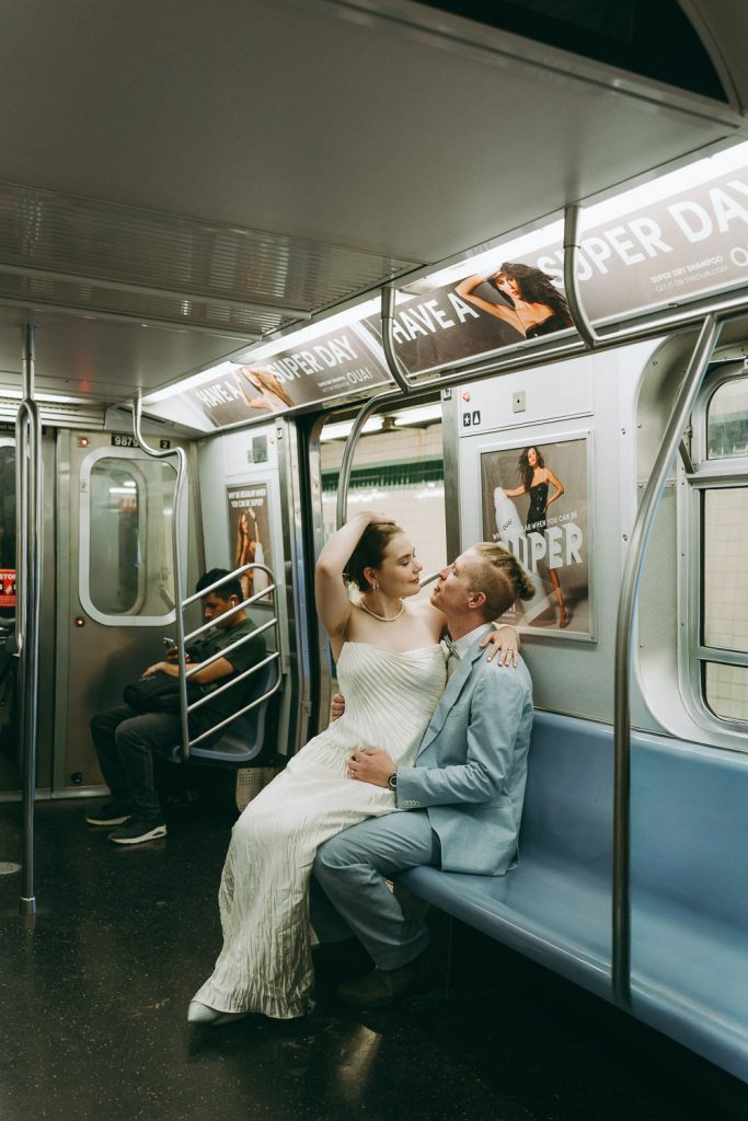Bride and groom in nyc subway on wedding day