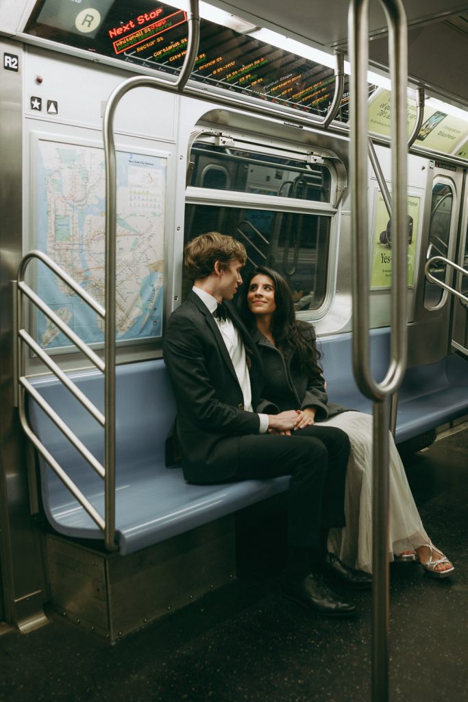Bride and groom riding nyc subway on wedding day