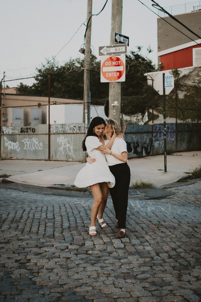 Queer couple during engagement session in brooklyn