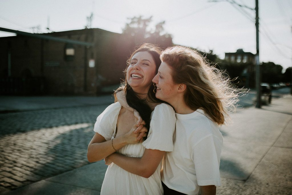 Queer couple during engagement session in brooklyn