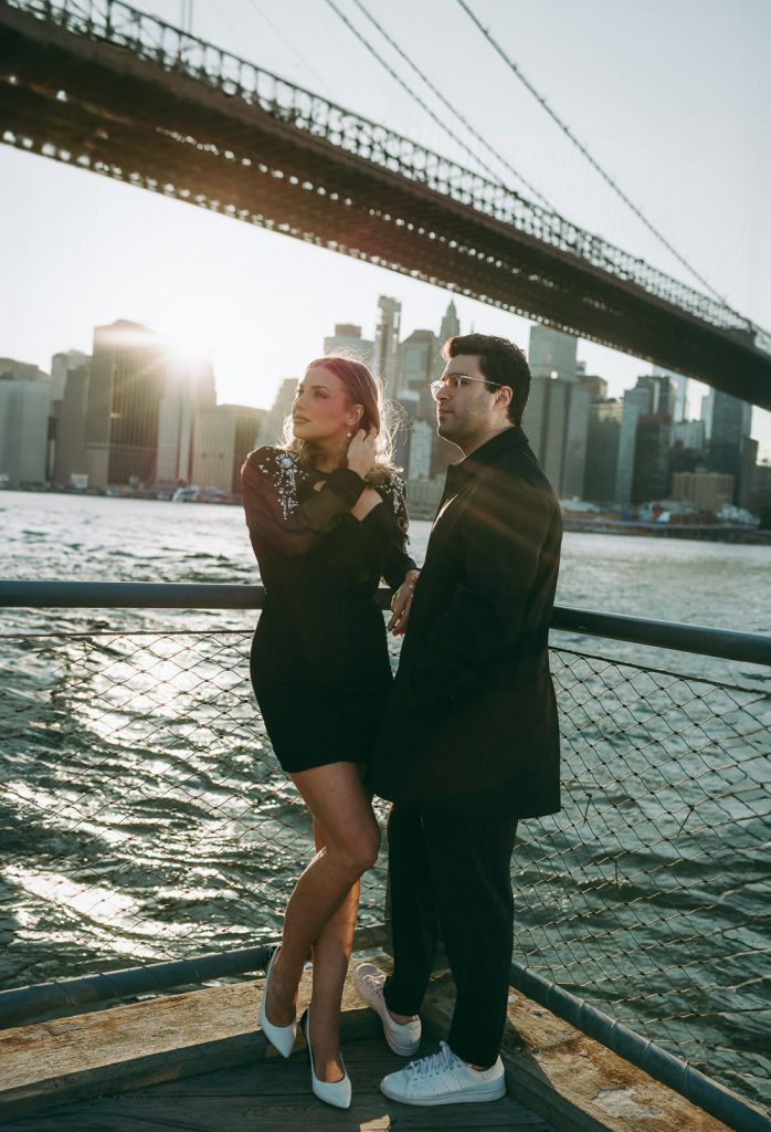Couple during engagement photoshoot in dumbo at golden hour