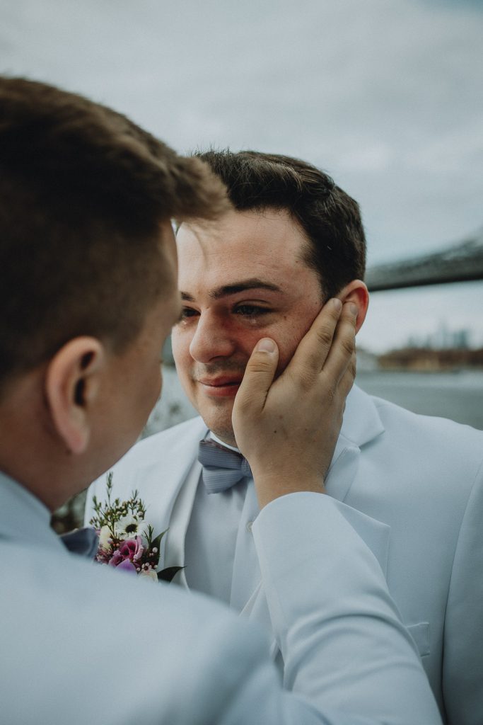 Gay grooms at brooklyn wedding by nyc skyline
