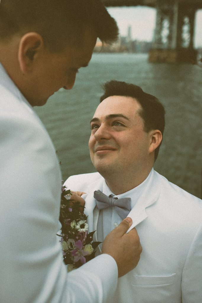Gay grooms at brooklyn wedding by nyc skyline