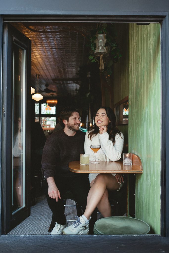 Couple in nyc bar during engagement photoshoot
