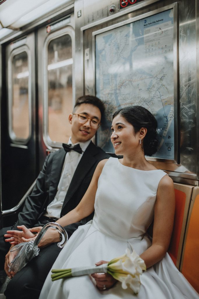 Bride and groom in nyc subway on elopement wedding day