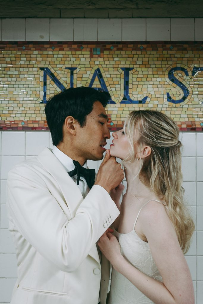 Bride and groom in nyc subway during nyc elopement wedding
