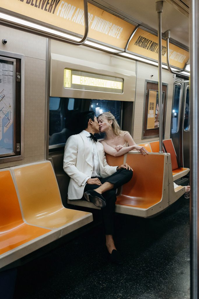 Bride and groom in nyc subway during nyc elopement wedding